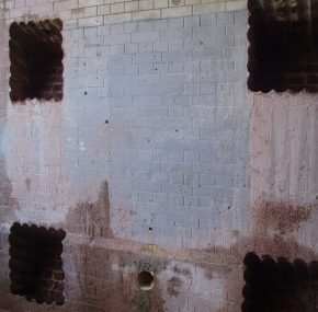 Stitch drilled recesses in brickwork wall